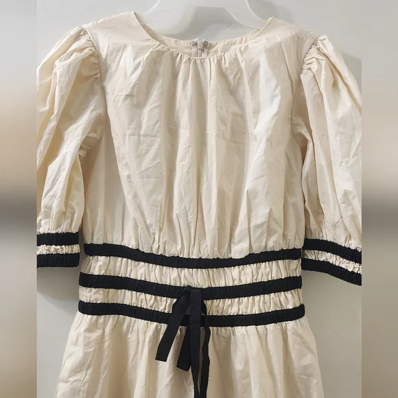 Aureum Elegant Cream Dress with Black Accents - Picture 2 of 11